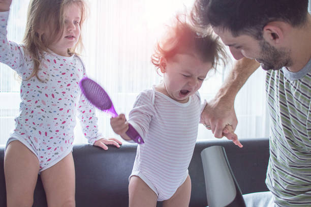 Father drying hair of her daughters Father drying hair of her daughters short human hair women little girls stock pictures, royalty-free photos & images