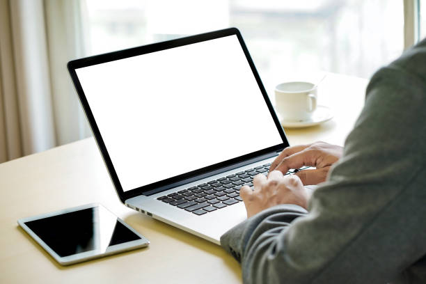 istock Workspace background new project on laptop computer with blank copy space screen for your advertising text message Laptop with blank screen on table. 901374208