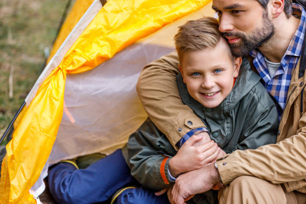 istock father and son in tent 901374888
