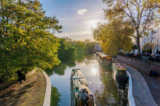 Scenery of Little Venice in London London: View of boats and nature in the famous Little Venice along the Regents Canal on October 30, 2017 in London little venice london stock pictures, royalty-free photos & images