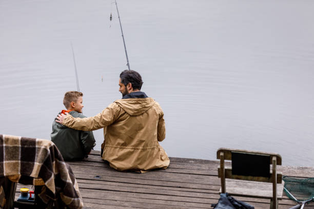istock father and son fishing together 901378626