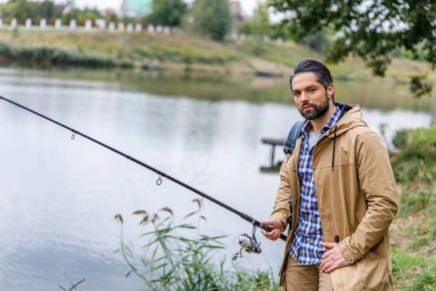 istock man fishing with rod 901381934