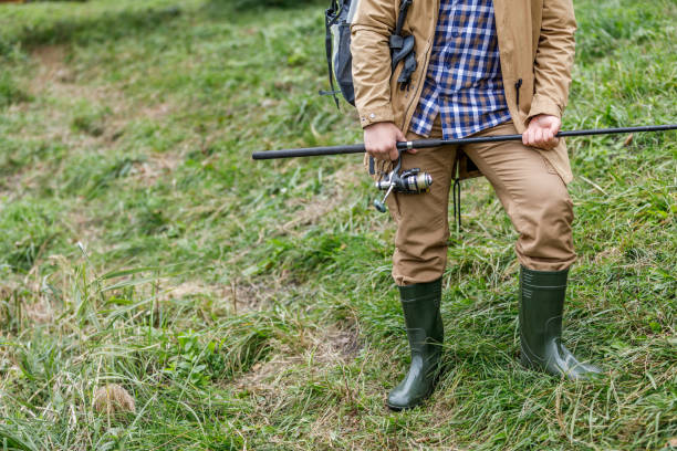 istock fisherman with fishing rod 901386486