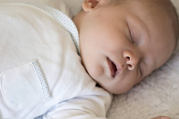istock Newborn Baby Sleeping Peacefully 901401900