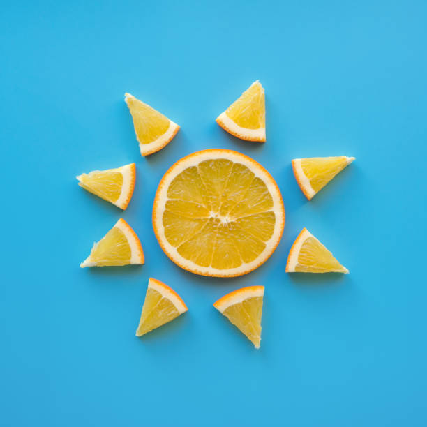istock Sliced orange fruit. Sunny weather theme. 901404660