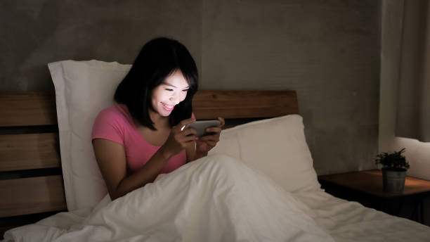 istock woman play mobile game 901405064