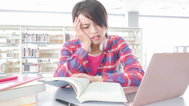 istock woman student in the library 901406146
