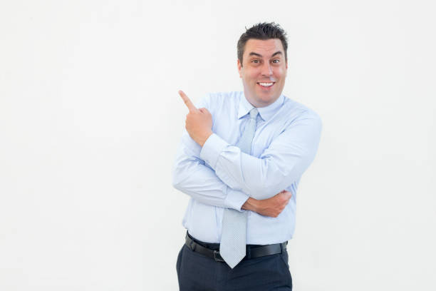 istock Happy Mature Business Leader Pointing Aside 901420562