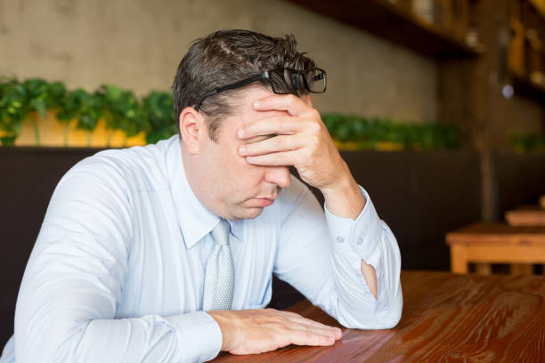 istock Stressed Business Man Working on Laptop in Cafe 901420634