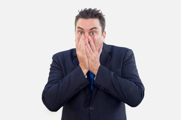 istock Shocked scared businessman covering mouth 901420724
