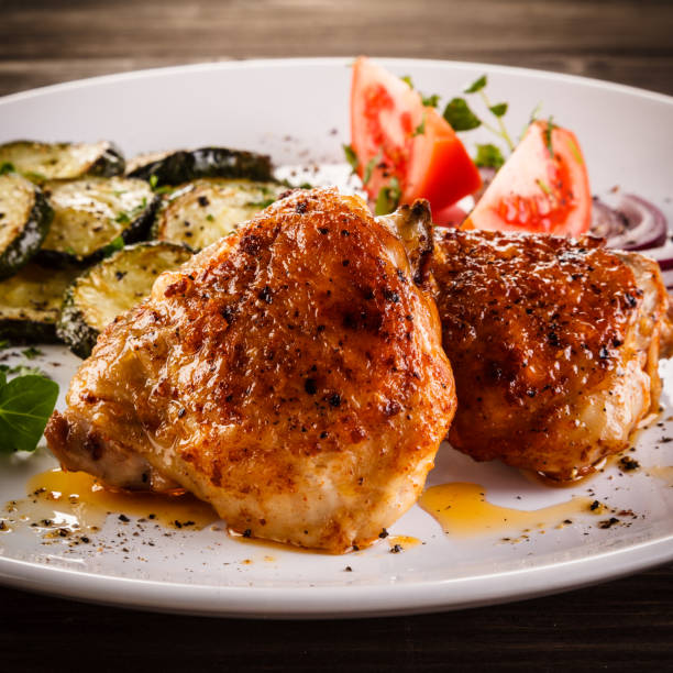istock Barbecued chicken thighs with vegetables 901421208