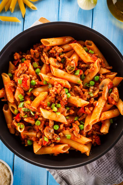 istock Penne with meat, tomato sauce and vegetables 901424388