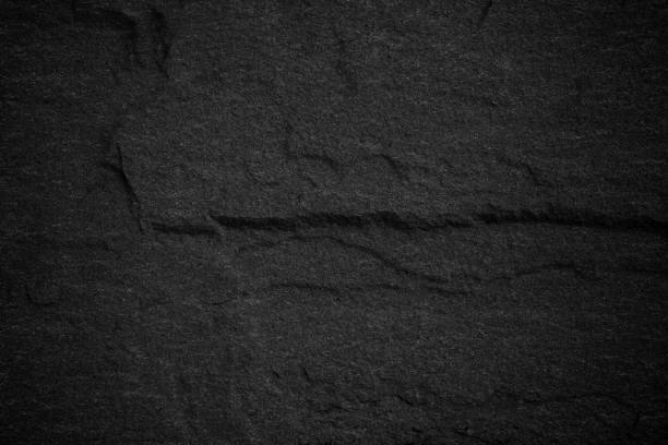 istock Dark grey black slate background or natural stone texture. 901427788
