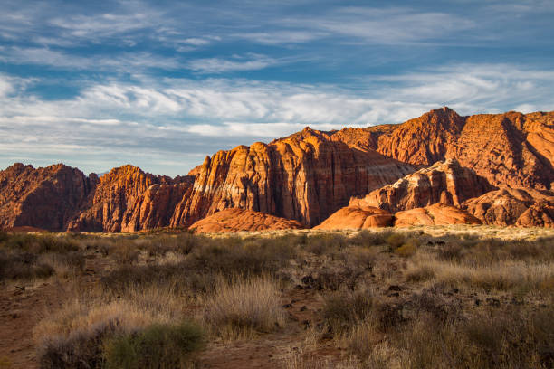 Spectacular sunrise illumination of the Navajo Sandstone mountains of Snow Canyon State Park Spectacular sunrise illumination of the Navajo Sandstone mountains of Snow Canyon State Park in Utah. snow canyon state park stock pictures, royalty-free photos & images