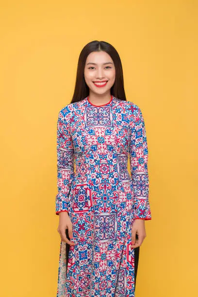 Vietnamese woman traditional festival costume Ao Dai. Tet holiday. Lunar New Year.