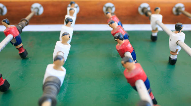 istock Wooden players in a foosball table 901428794