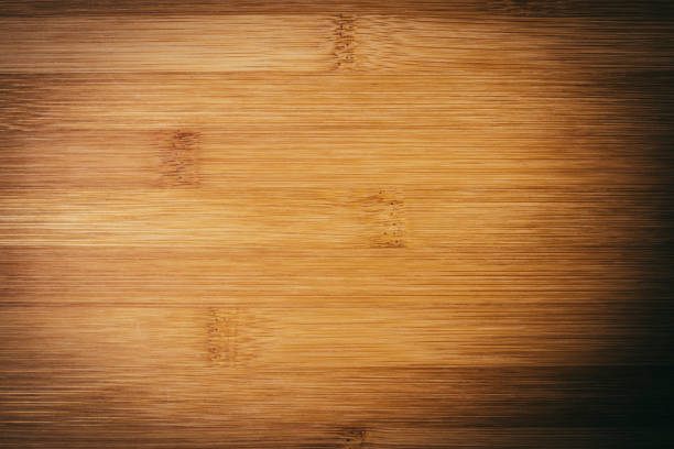 istock Wooden plain board background texture on a dark cornering vignette 901432170