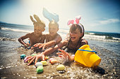 Kids playing in sea during summer Easter