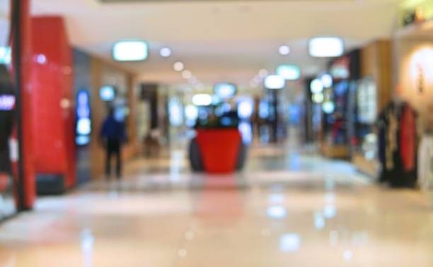 istock Blur background shopping center with people walking inside. Blur background busy modern mall with customer looking for product 901435988