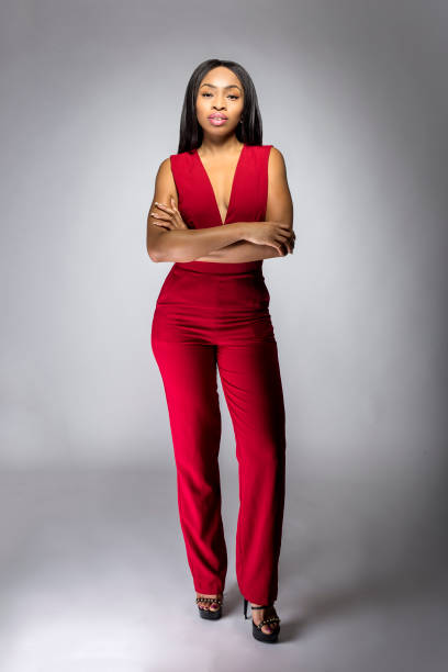spring fashion black female model with red pantsuit - fato de senhora imagens e fotografias de stock