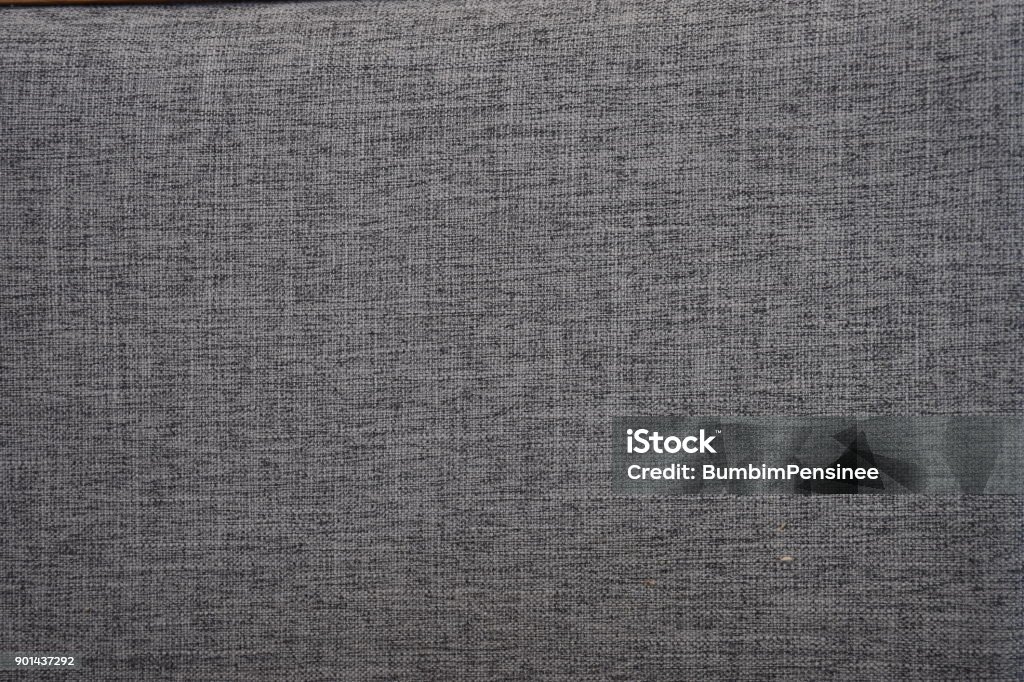 Gray cotton fabrics texture. Cotton fabrics can be very soft and comfortable hand at first touch, a texture that is soft, making it ideal stretchy and strong  for casual and relaxed garments. Gray Color Stock Photo