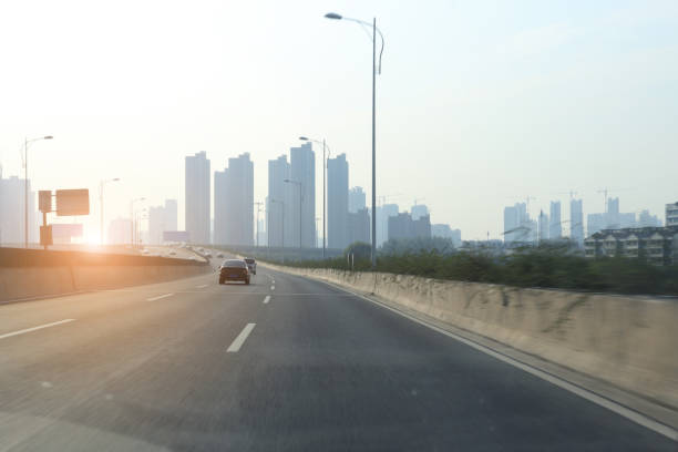 istock modern city road and building 901437434