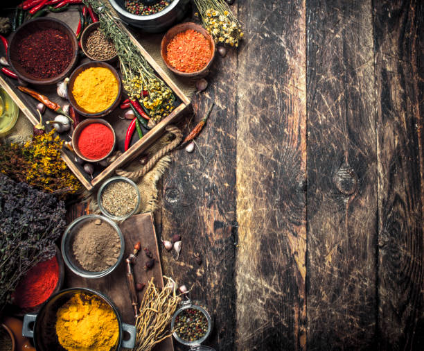 istock Various ground spices and herbs in an old tray. 901438164