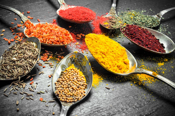 istock Ground spices and herbs in spoons. 901440000