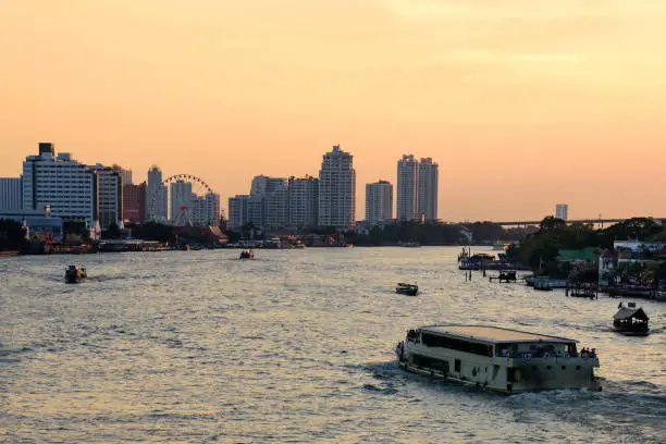 Photo of Cityscape of Asiatique the Riverfront is popular and famous place in the evening with sunset time at Bangkok, Thailand.