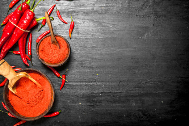 istock Ground hot peppers in a wooden bowl. 901456940
