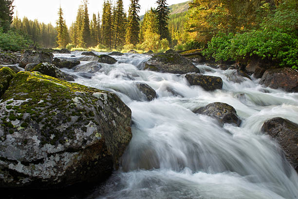 istock Sunrise and mountain flowing stream 90146348