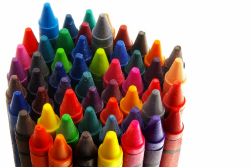 Close-up of colored pencils on white background with copy space