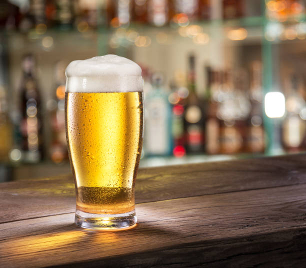 istock Frosty glass of light beer on the bar counter. 901468384