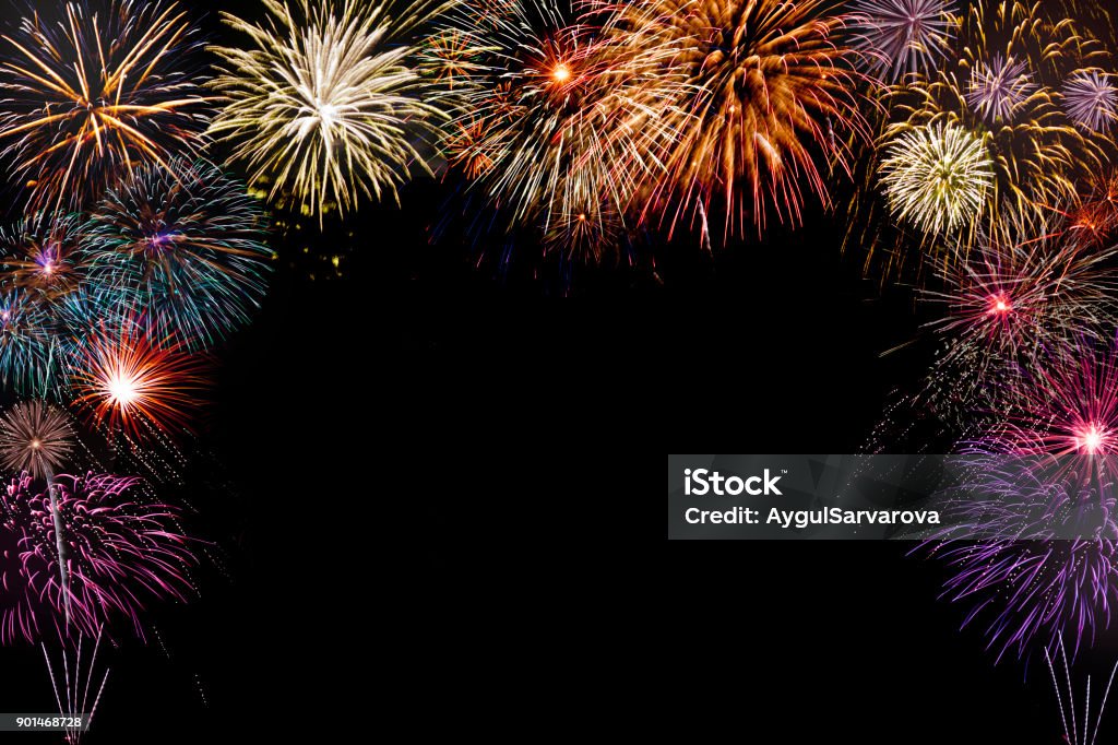 isolated colourful fireworks background with space in the middle isolated new year fireworks on black background with copy space in the middle Firework - Explosive Material Stock Photo