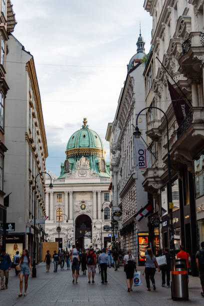 Kohlmarkt street in Vienna with Hofburg palace on background Vienna,  Austria - August 16, 2017: View of Kohlmarkt with Hofburg palace on background. Originally known as Coal Market is one of the oldest streets in Vienna. kohlmarkt street photos stock pictures, royalty-free photos & images