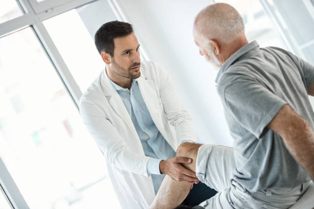 istock Senior man having medical exam. 901476912