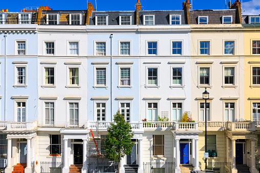 Facade of colourful terraced houses around Pimlico area in London