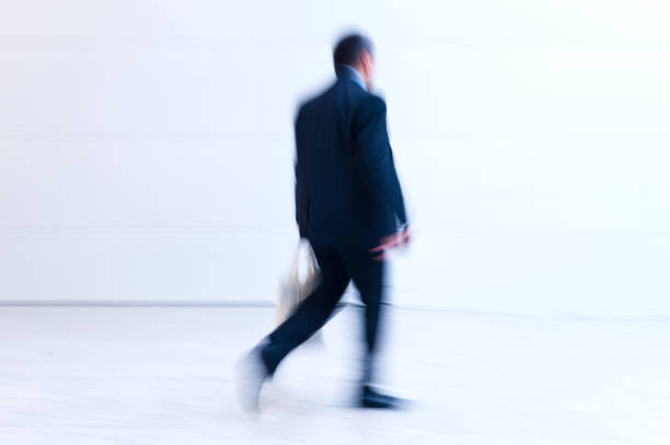 istock blurred trade fair visitors in a modern hall 901477804