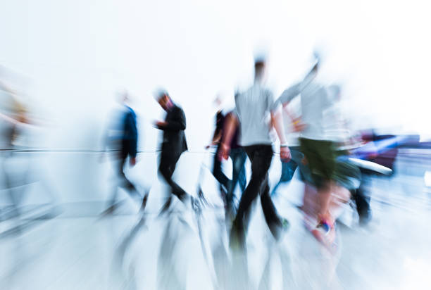 istock blurred trade fair visitors in a modern hall 901477852