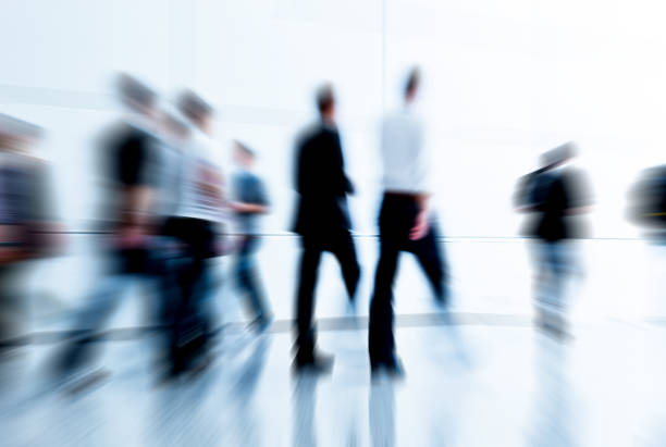 istock blurred trade fair visitors in a modern hall 901477860