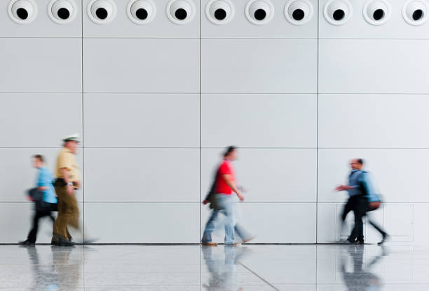 istock blurred trade fair visitors in a modern hall 901478606