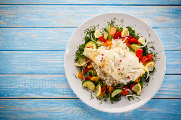istock Roast fish with white rice and vegetables 901478808