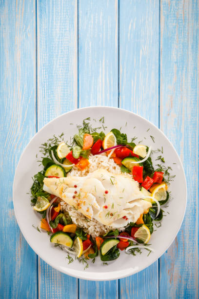 istock Roast fish with white rice and vegetables 901478936