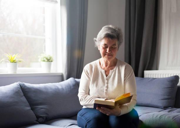 istock senior woman with Bible 901482074