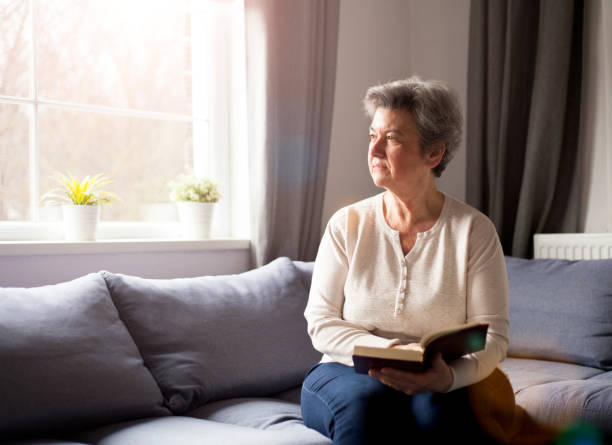 istock senior woman with Bible 901484212
