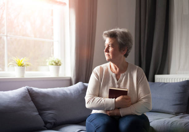 istock senior woman with Bible 901484432