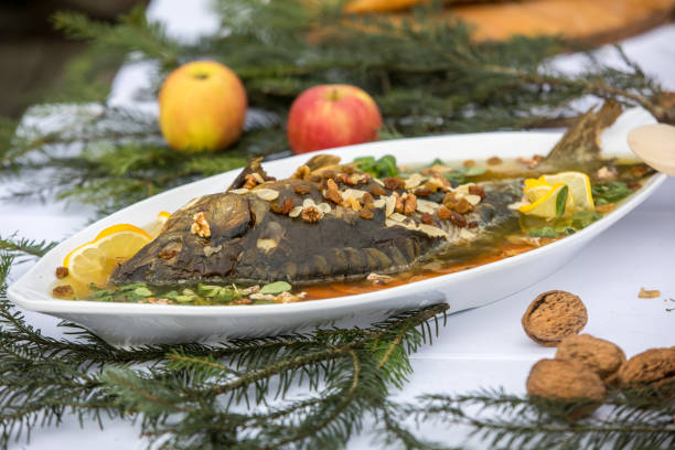 carp  with lemon, dill and raisins on plate carp  with lemon, dill and raisins on plate aspic stock pictures, royalty-free photos & images