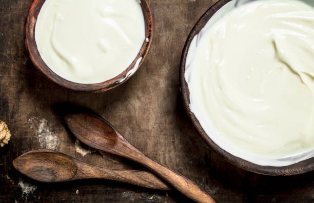 istock Natural yogurt in a bowl with a spoon. 901485744