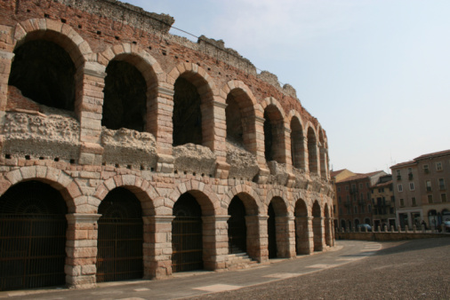 Verona amphitheatre during a sunny spring day with many tourists. The Arena is located in the city center and during the summer it is a theater with many different shows.