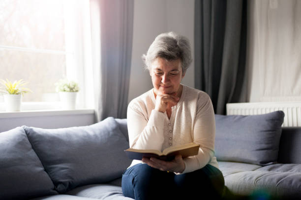 istock senior woman with Bible 901488610
